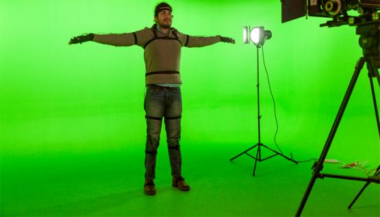 A student at Lesley University College of Art and Design models a motion capture system by Noitom.
